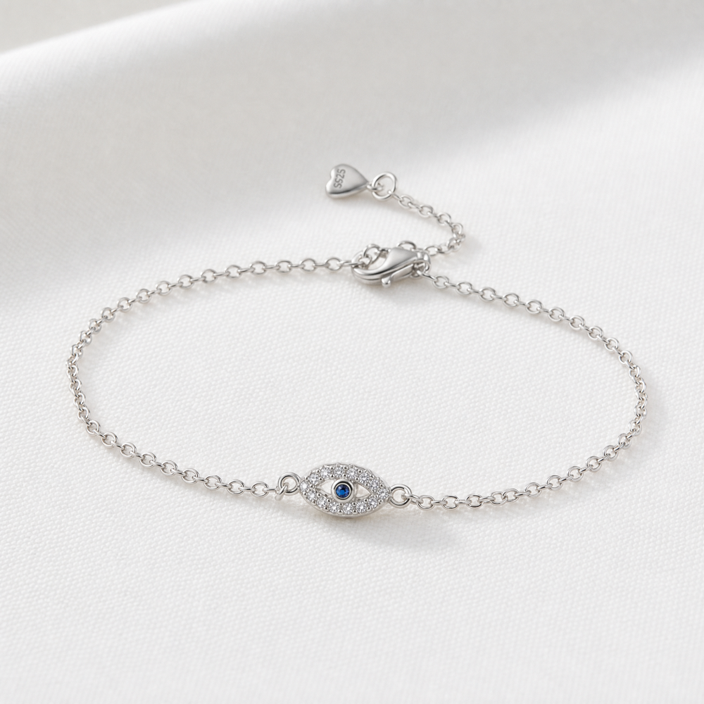 Silverarmband med evil eye i blått och klara stenar